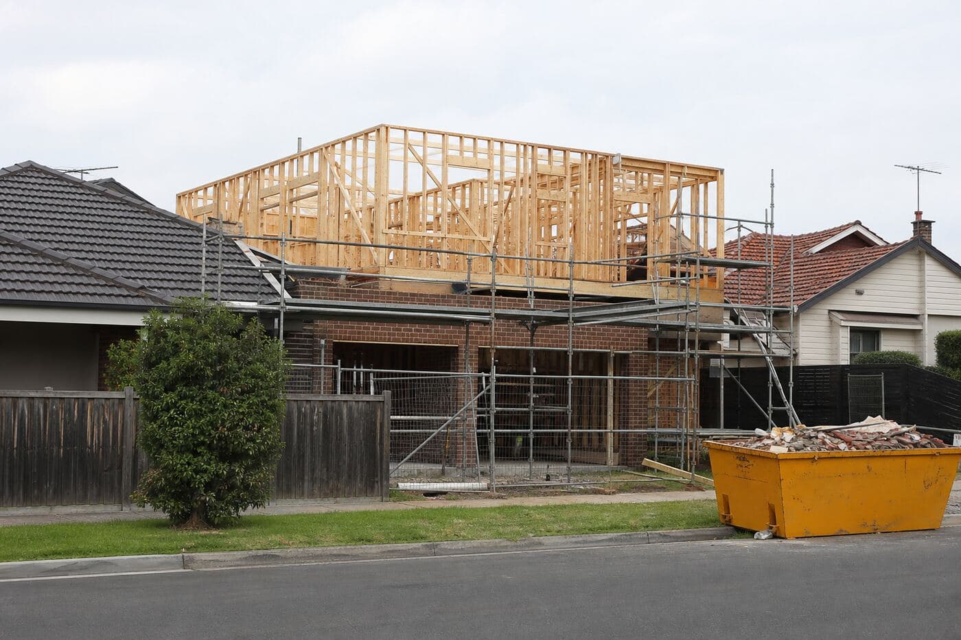 Residential building work beside existing houses
